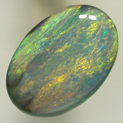 SOLID SEMI BLACK OPAL Sheen pattern with orange and yellow over a background of ocean blue